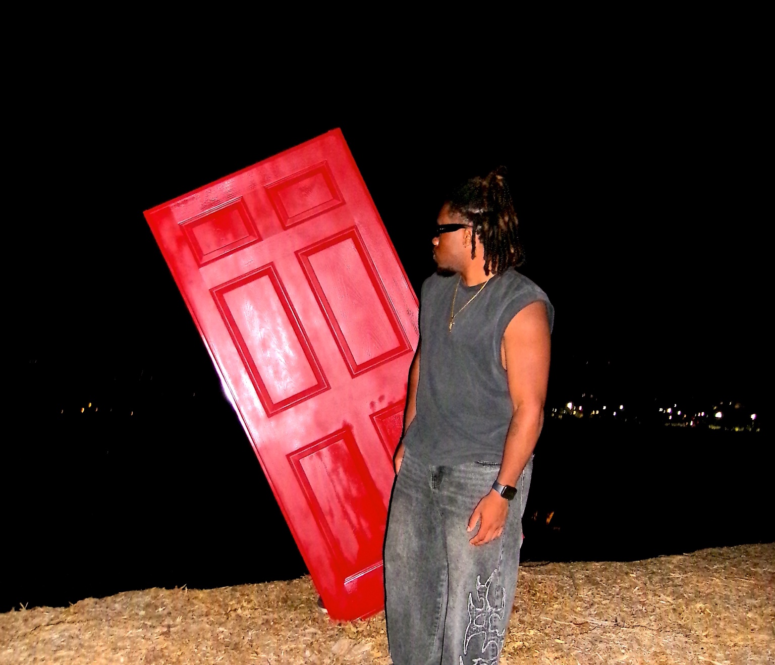 Shalant near a tilted red door
